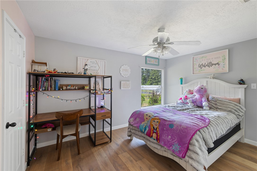 2092 Farm To Market 1486 Anderson, TX 77830 - Photo 13 of 42 a bedroom with a bed and a table in it