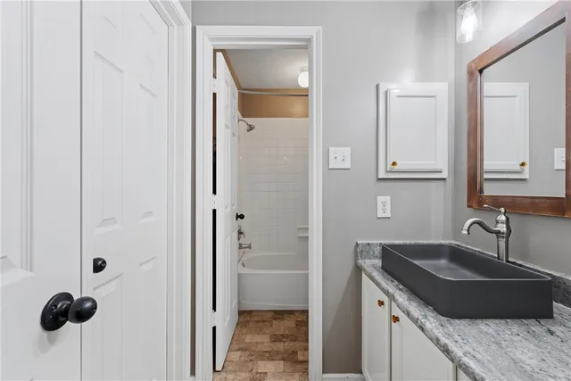 a kitchen with a sink and a refrigerator