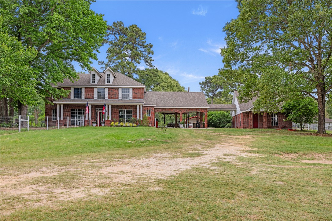 2092 Farm To Market 1486 Anderson, TX 77830 - Photo 18 of 42 a front view of a house with a garden