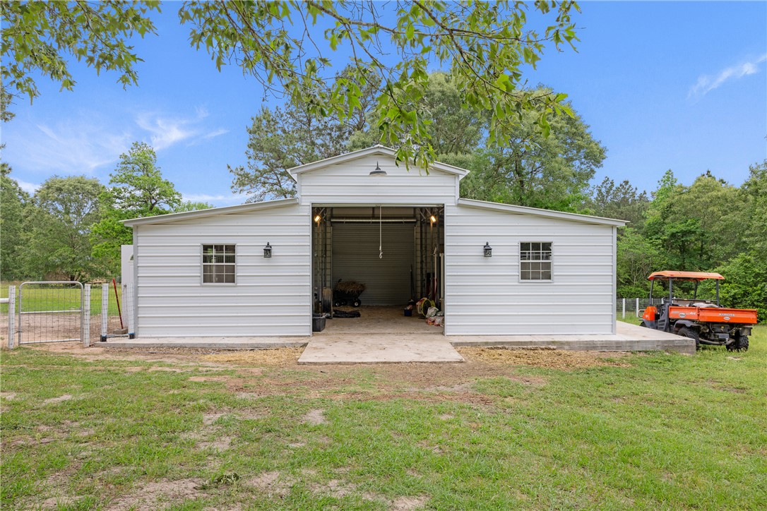 2092 Farm To Market 1486 Anderson, TX 77830 - Photo 27 of 42 a front view of a house with garden