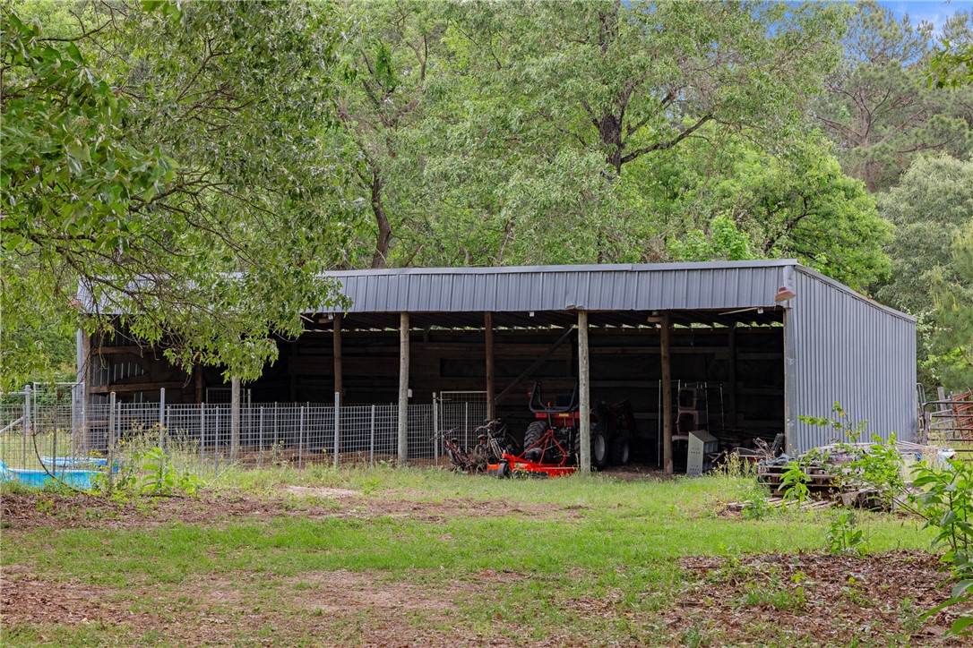 2092 Farm To Market 1486 Anderson, TX 77830 - Photo 35 of 42 a view of a backyard with table and chairs and potted plants