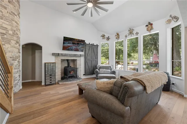 a living room with furniture fireplace and flat screen tv