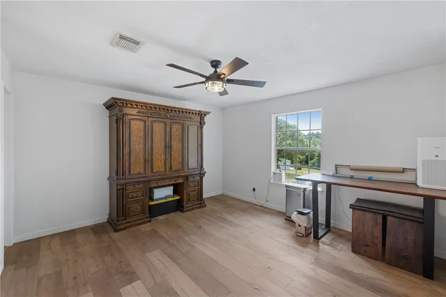 a view of workspace with furniture and window