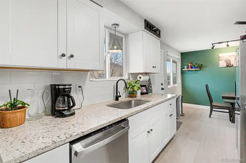 a kitchen with a sink and cabinets
