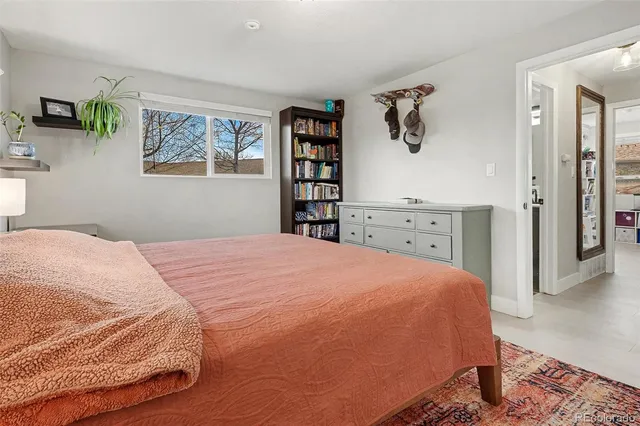 a bedroom with a bed and a cabinets