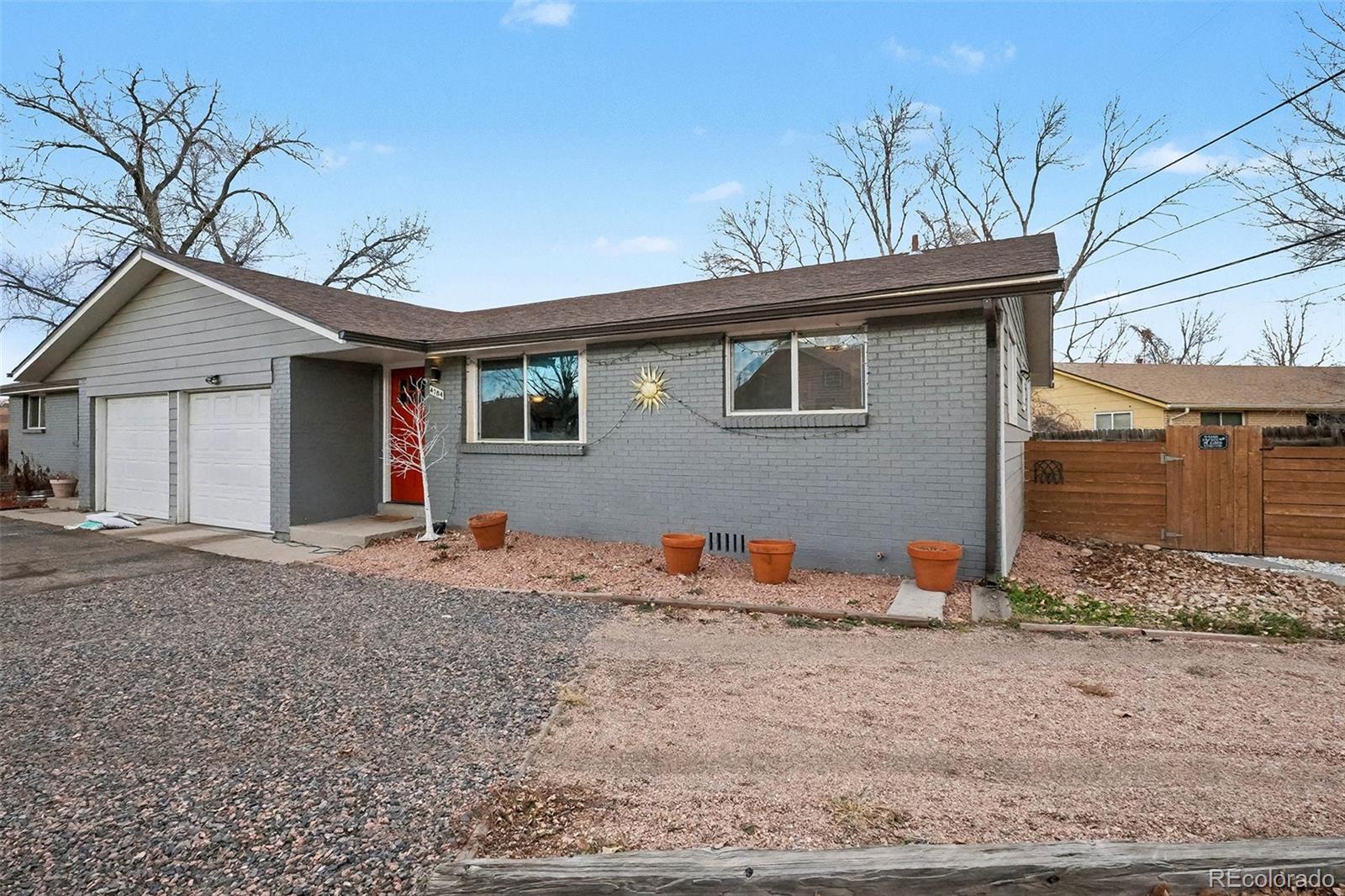 4784 Swadley Street Wheat Ridge, CO 80033 - Photo 3 of 22 a backyard of a house