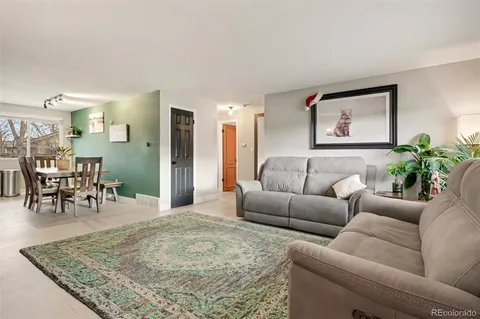 a living room with furniture and a table