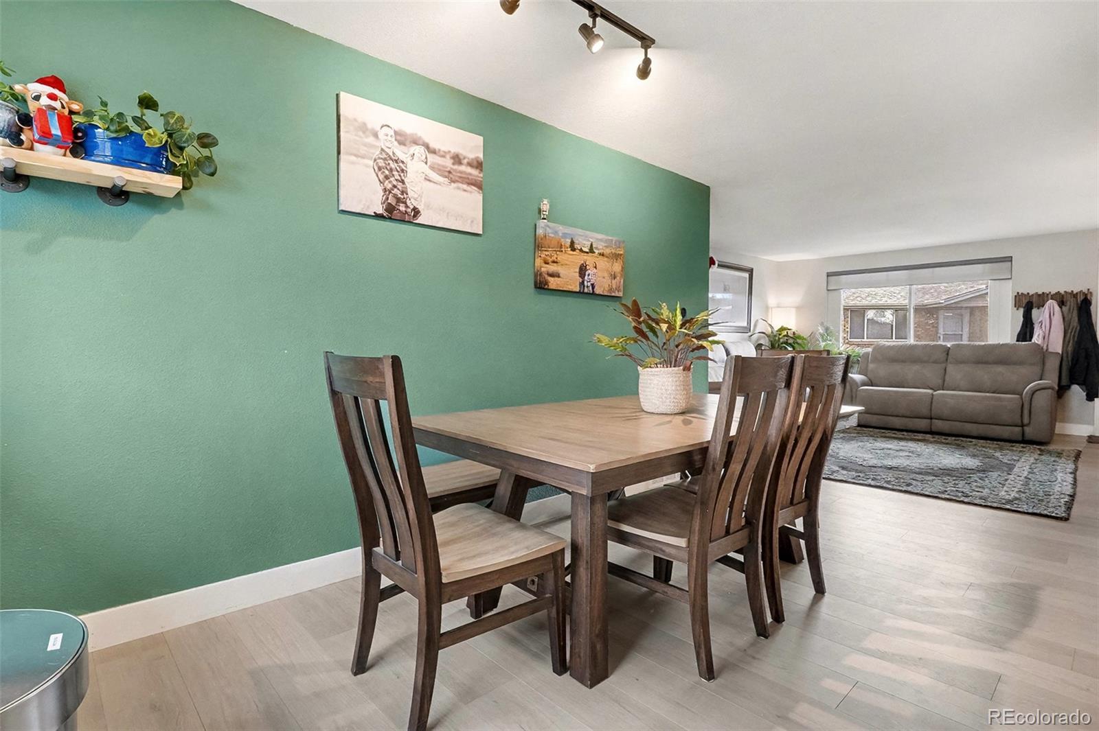 4784 Swadley Street Wheat Ridge, CO 80033 - Photo 7 of 22 a view of a dining room with furniture
