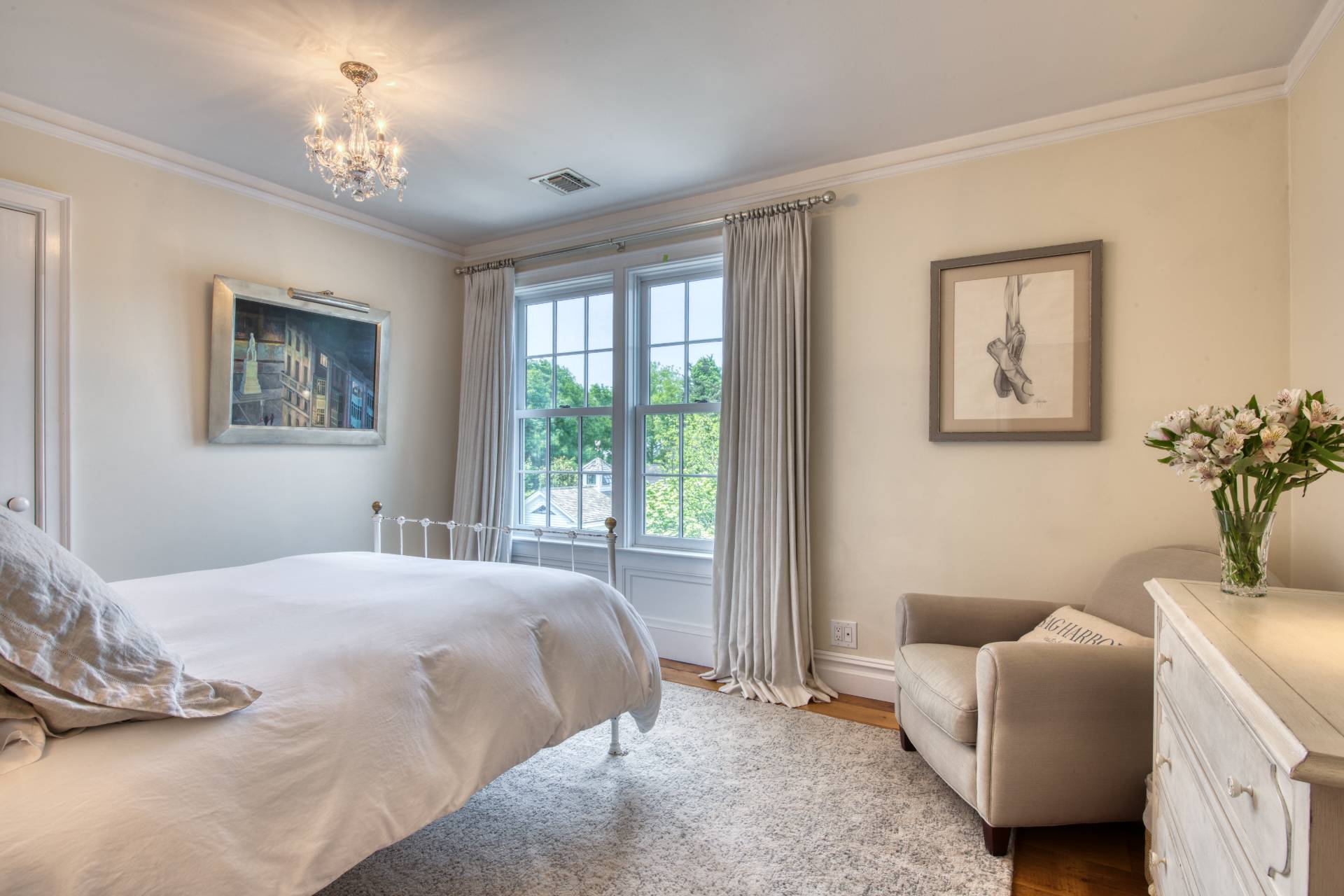 23 Howard Street Sag Harbor, NY 11963 - Photo 11 of 14 a bedroom with a bed couches chair and a window