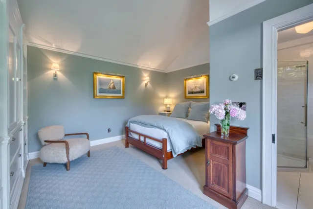 a front view of a house with yard and green space