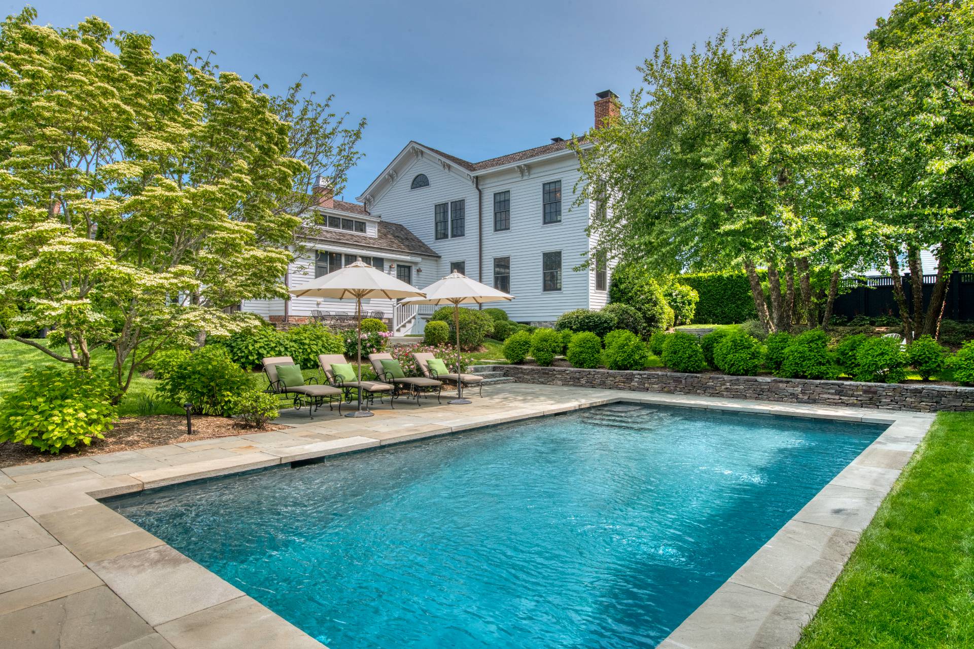 23 Howard Street Sag Harbor, NY 11963 - Photo 14 of 14 a front view of a house with yard and green space