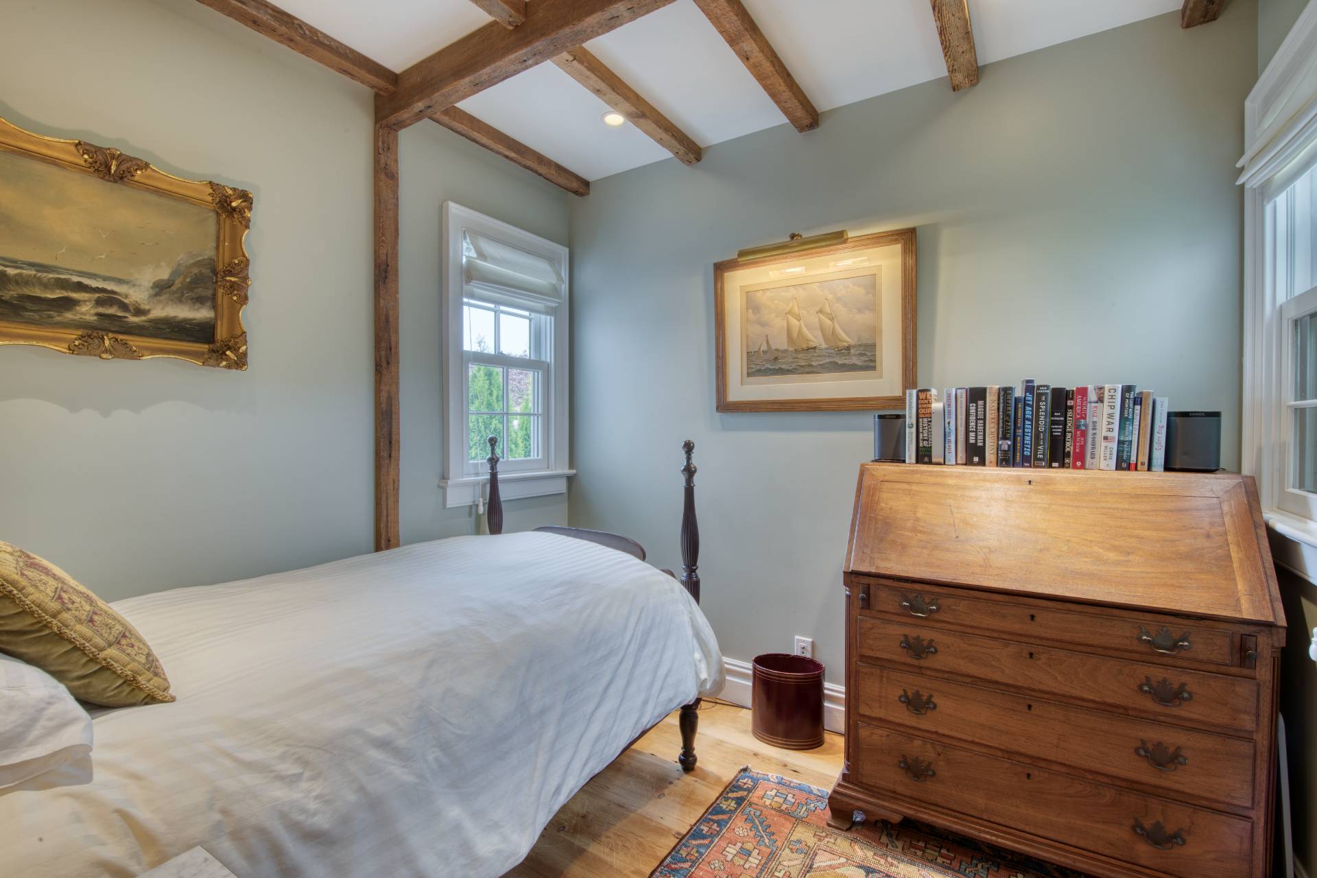 23 Howard Street Sag Harbor, NY 11963 - Photo 8 of 14 a bedroom with a bed and a flat screen tv