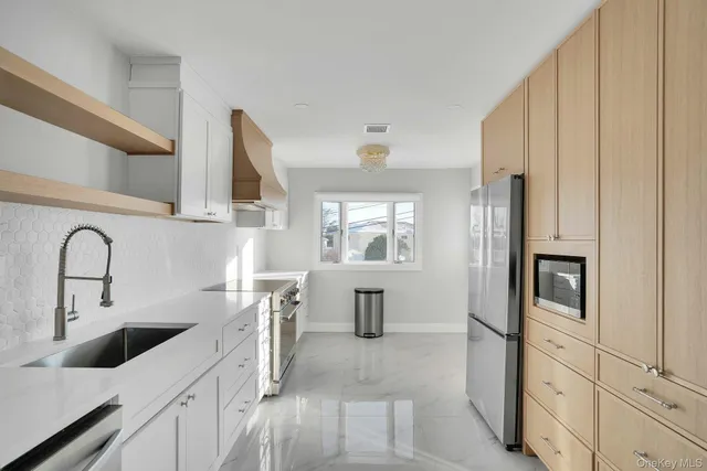 a kitchen with cabinets and window