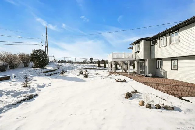 a view of a porch with wooden floor and fence
