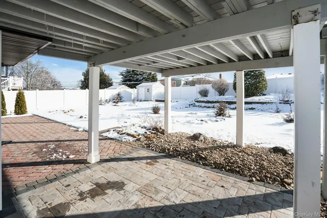 a view of pool with lawn chairs