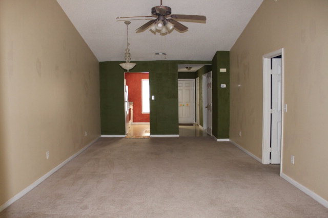 112 Single Tree Lane Aiken, SC 29803 - Photo 3 of 11 an empty room with chandelier fan and windows