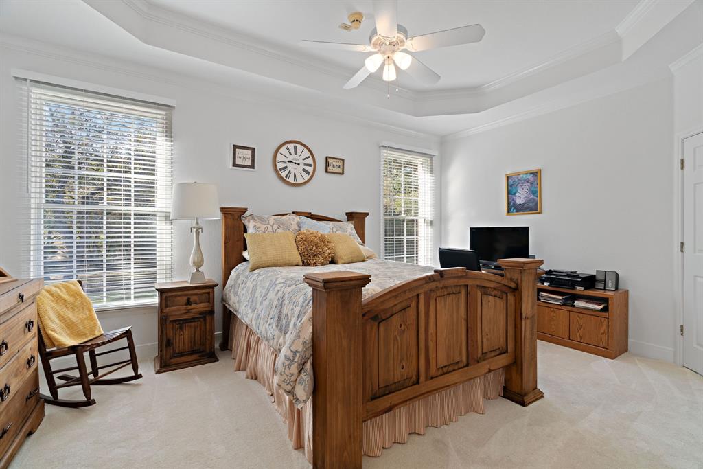 72 Crown Road Willow Park, TX 76087 - Photo 18 of 40 a bedroom with a bed and a couch