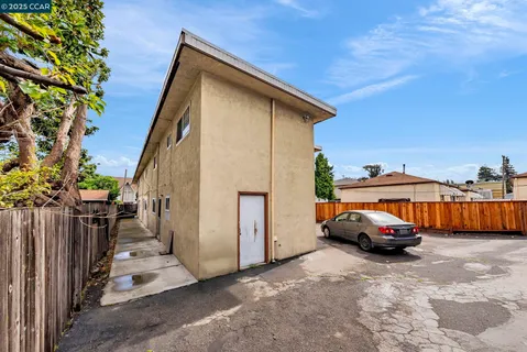 a view of a car parked in front of a house