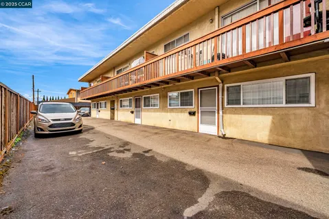 a view of a car park in front of house