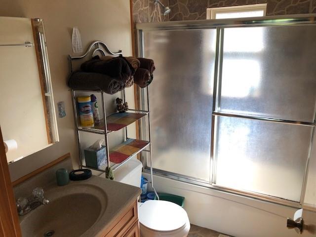 696 Blue Rock Road Purlear, NC 28665 - Photo 14 of 34 a bathroom with a sink and a mirror