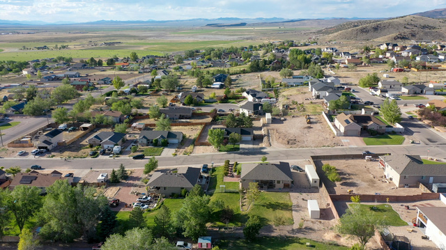 1797 Sunset Road Enoch, UT 84721 - Photo 68 of 80 Aerial perspective showcasing a residential neighborhood with a variety of single-story and multi-story homes
