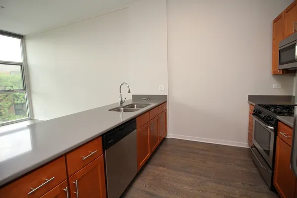 a kitchen with a sink and a window