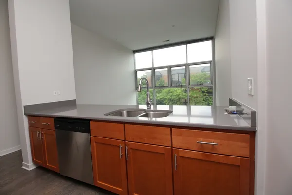 a room with a sink and cabinets