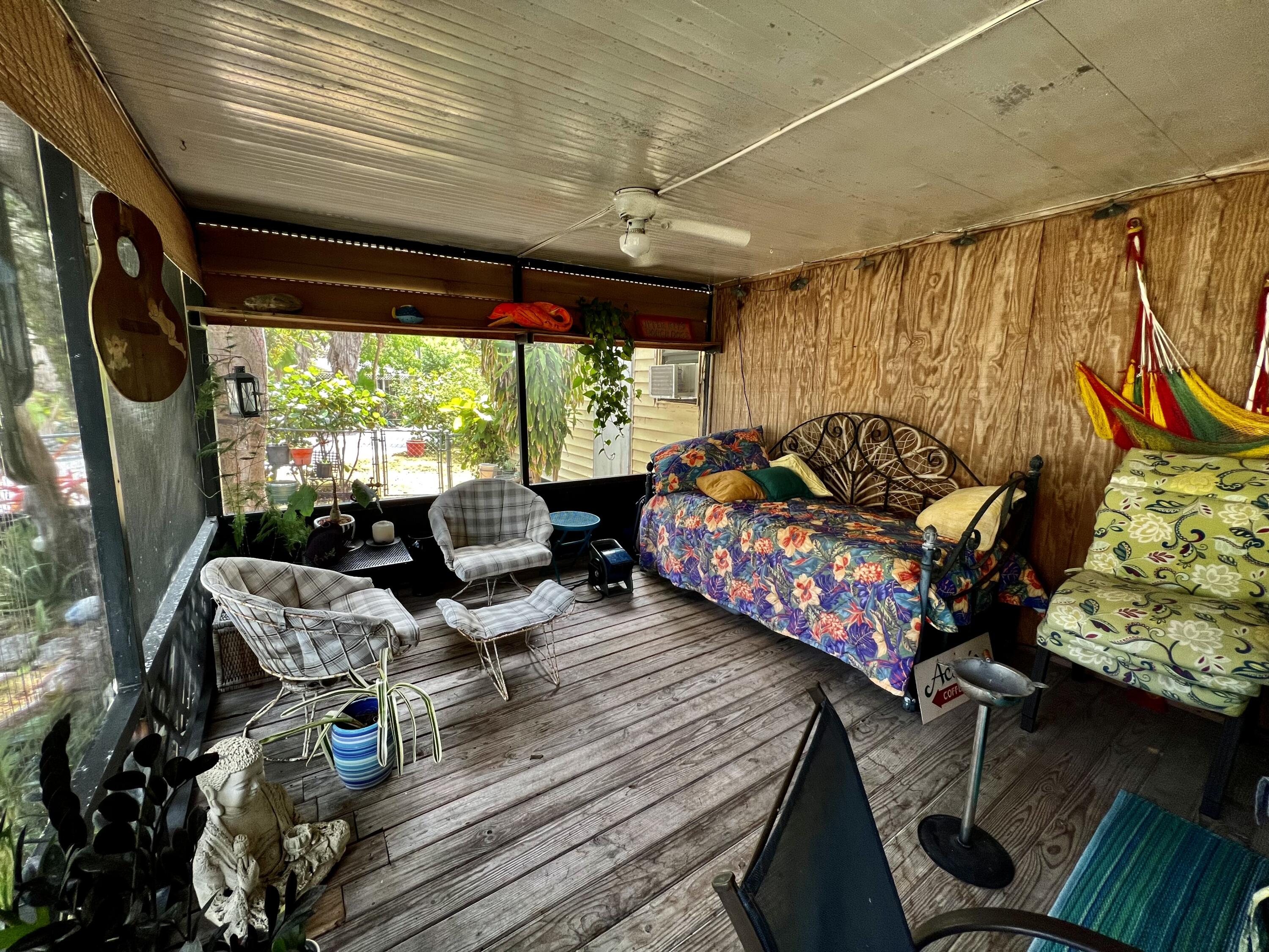 702 Largo Road Key Largo, FL 33037 - Photo 14 of 19 a living room with furniture and a large window