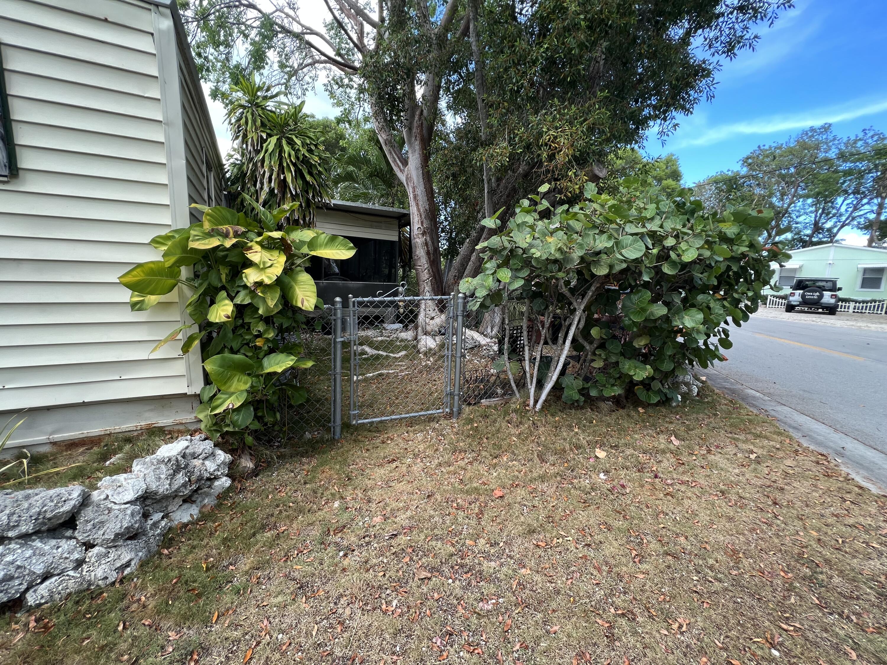 702 Largo Road Key Largo, FL 33037 - Photo 15 of 19 a plant is in front of a house