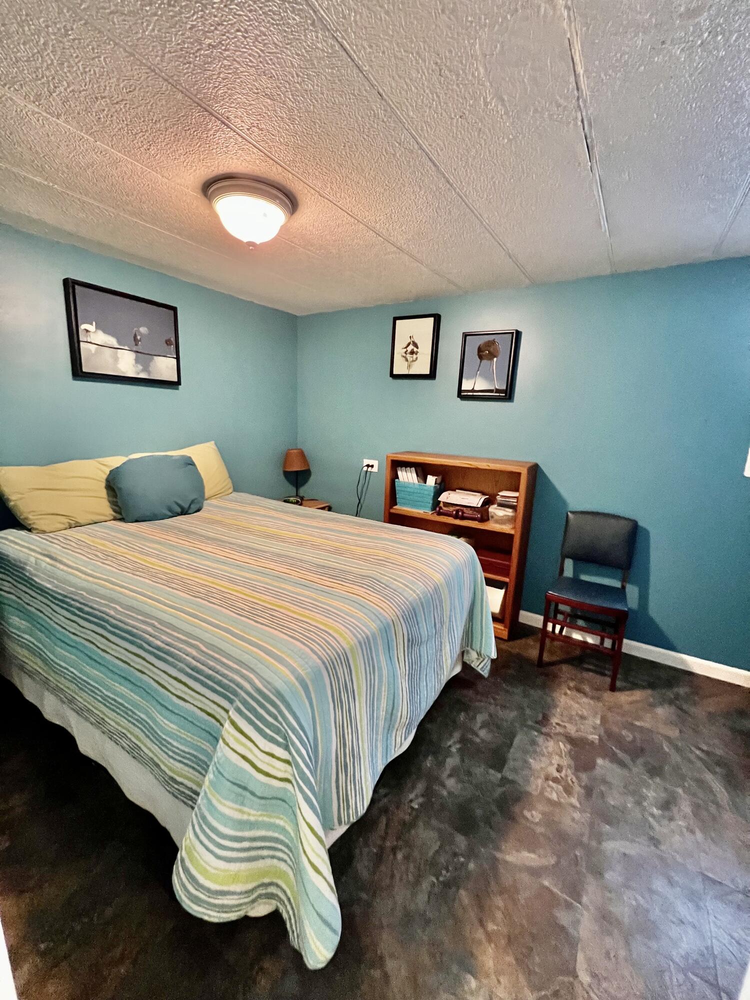 702 Largo Road Key Largo, FL 33037 - Photo 9 of 19 a bedroom with bed and a desk