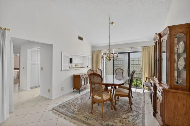 a view of a dining room with furniture and window