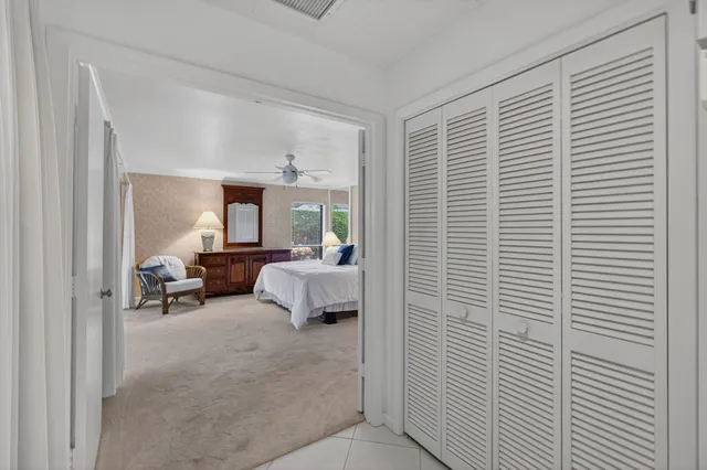 a bedroom with bed and window