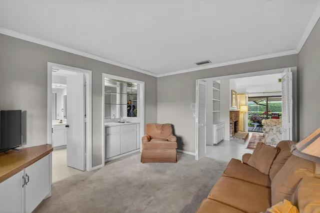 a bathroom with a toilet sink a mirror a bathtub and shower