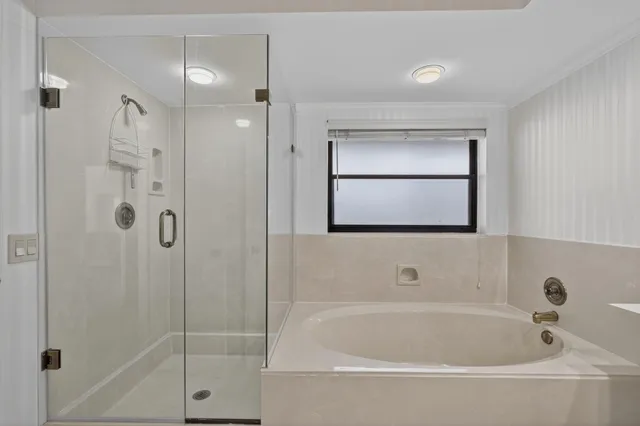 a bed room with a bed and a chair