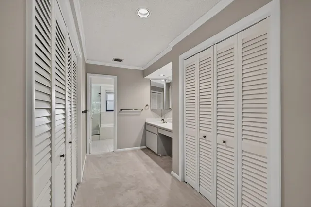 a bedroom with a bed and a lamp