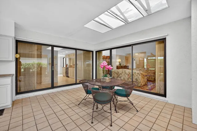 a kitchen with sink cabinets and outdoor view