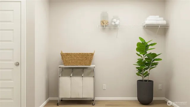 a view of dining room with wooden floor and a potted plant
