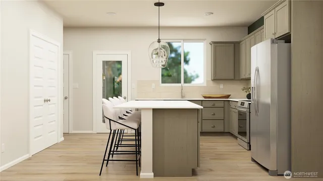 a kitchen with a sink appliances cabinets and a counter top space