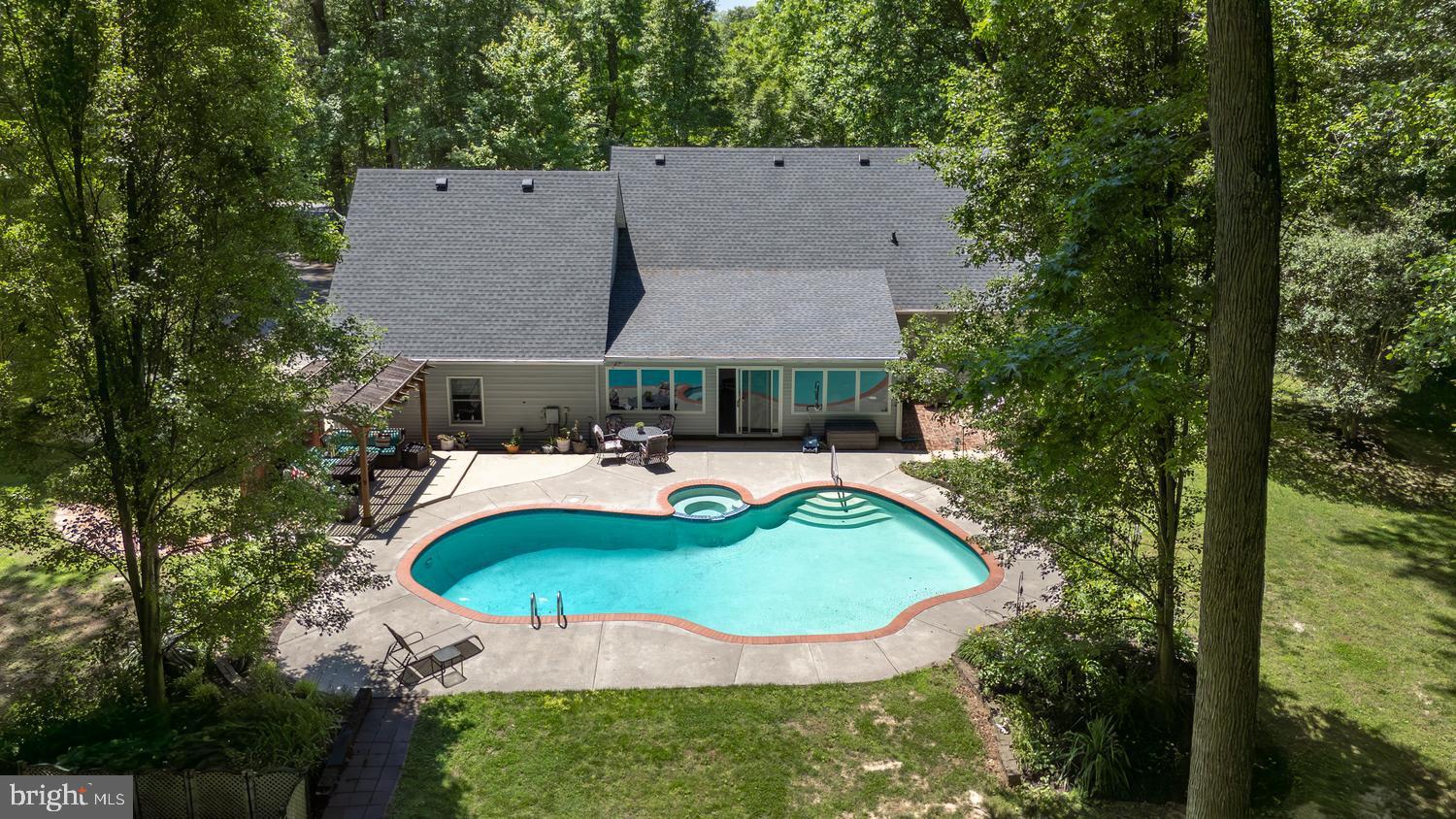 814 Wrights Neck Road Centreville, MD 21617 - Photo 9 of 53 an aerial view of house with swimming pool and green space