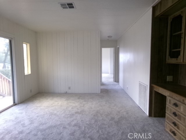 324 Ridgecrest Parkway Oroville, CA 95966 - Photo 15 of 33 a view of an empty room with a window and a kitchen