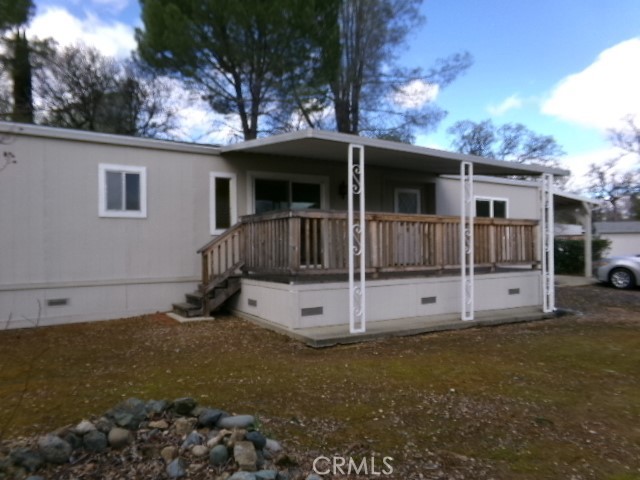324 Ridgecrest Parkway Oroville, CA 95966 - Photo 2 of 33 a view of a house with backyard and a tree
