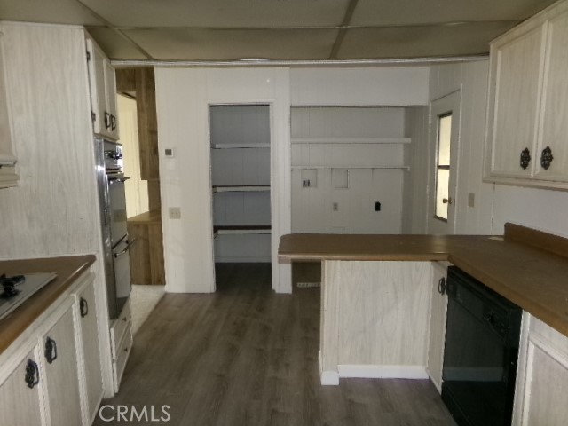 324 Ridgecrest Parkway Oroville, CA 95966 - Photo 30 of 33 a kitchen with a refrigerator and a stove top oven
