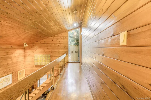 a view of a balcony with wooden floor