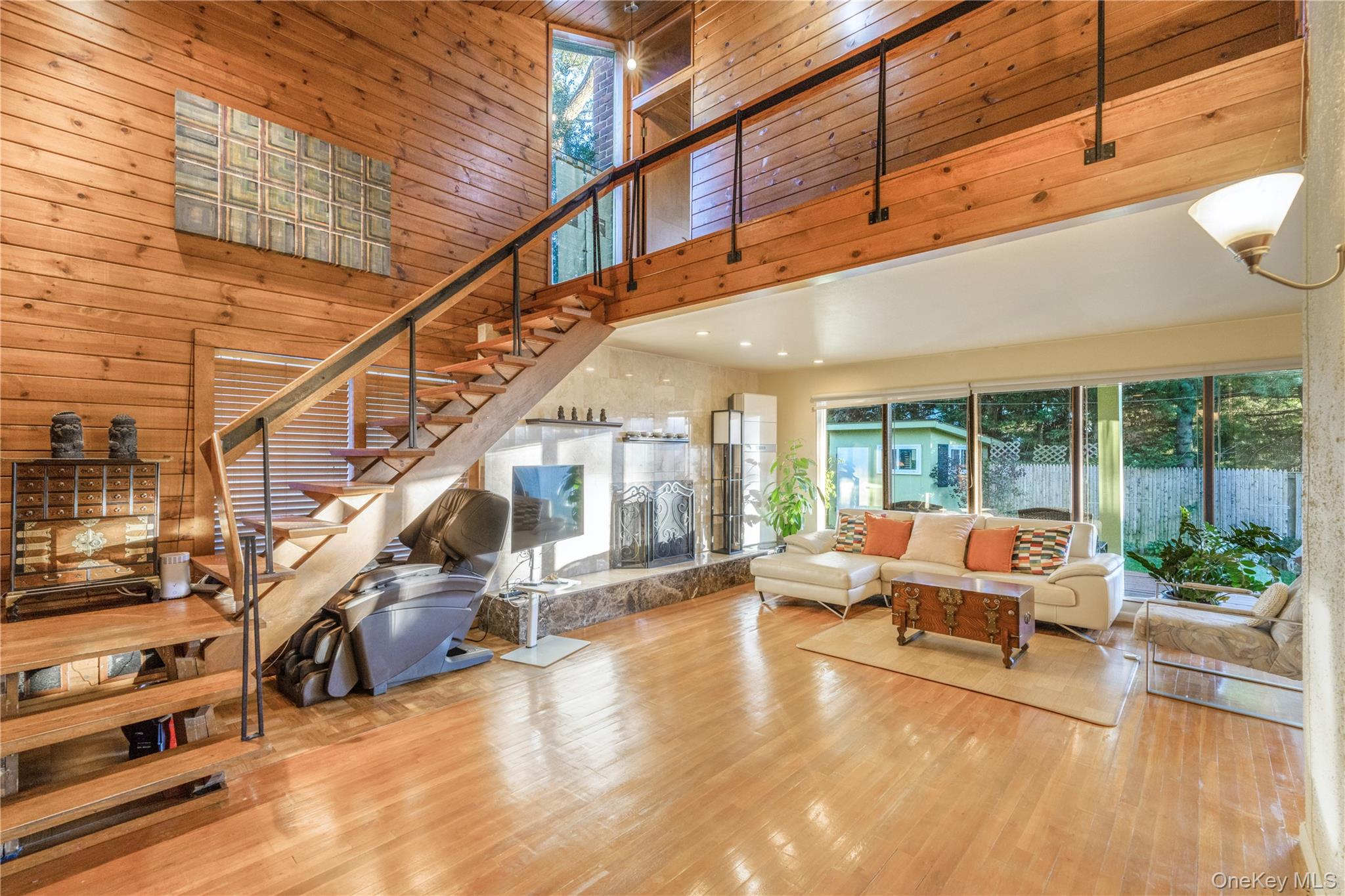 78 Joyce Road Plainview, NY 11803 - Photo 2 of 23 a lobby with furniture and a potted plant