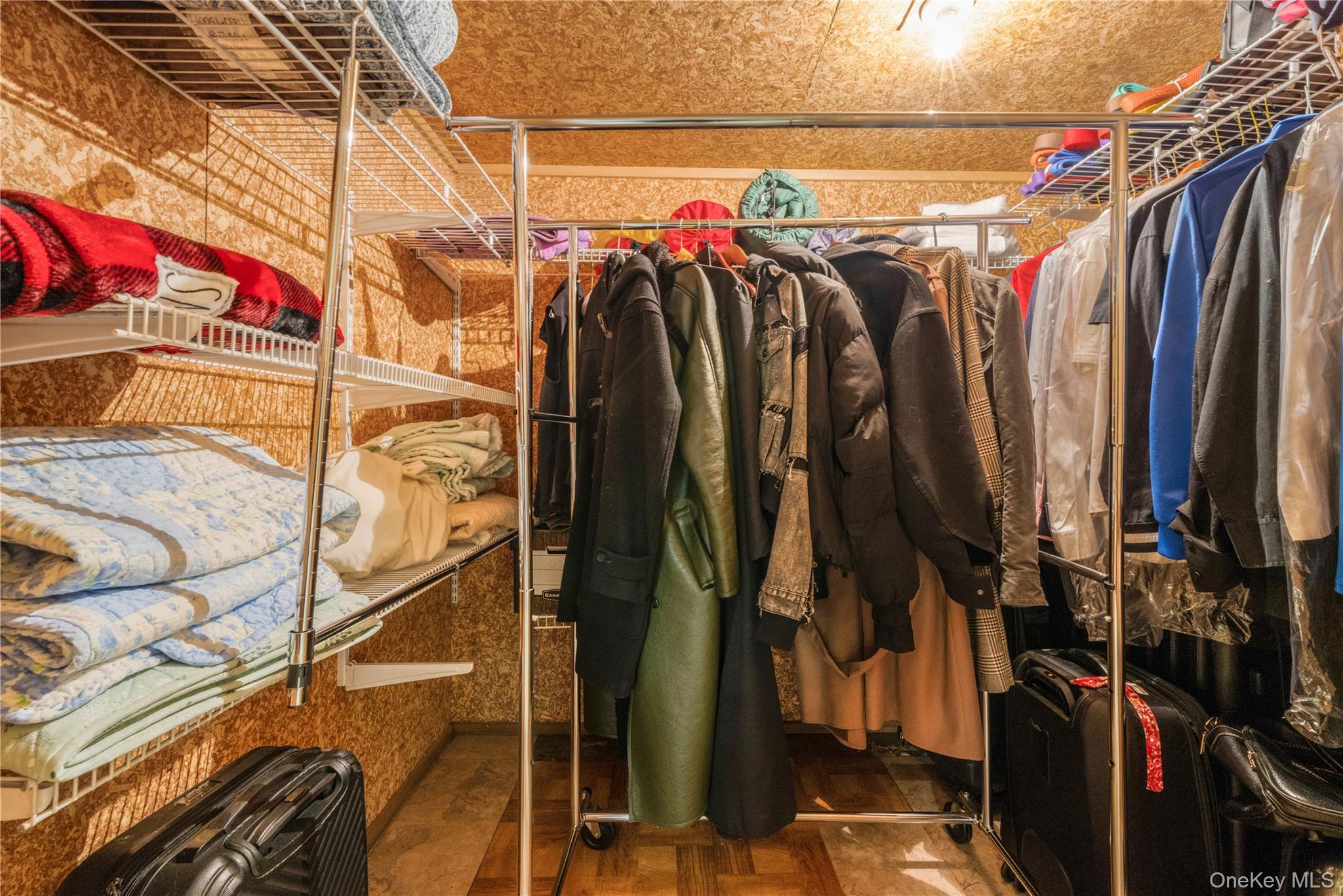 78 Joyce Road Plainview, NY 11803 - Photo 21 of 23 a view of walk in closet with clothes