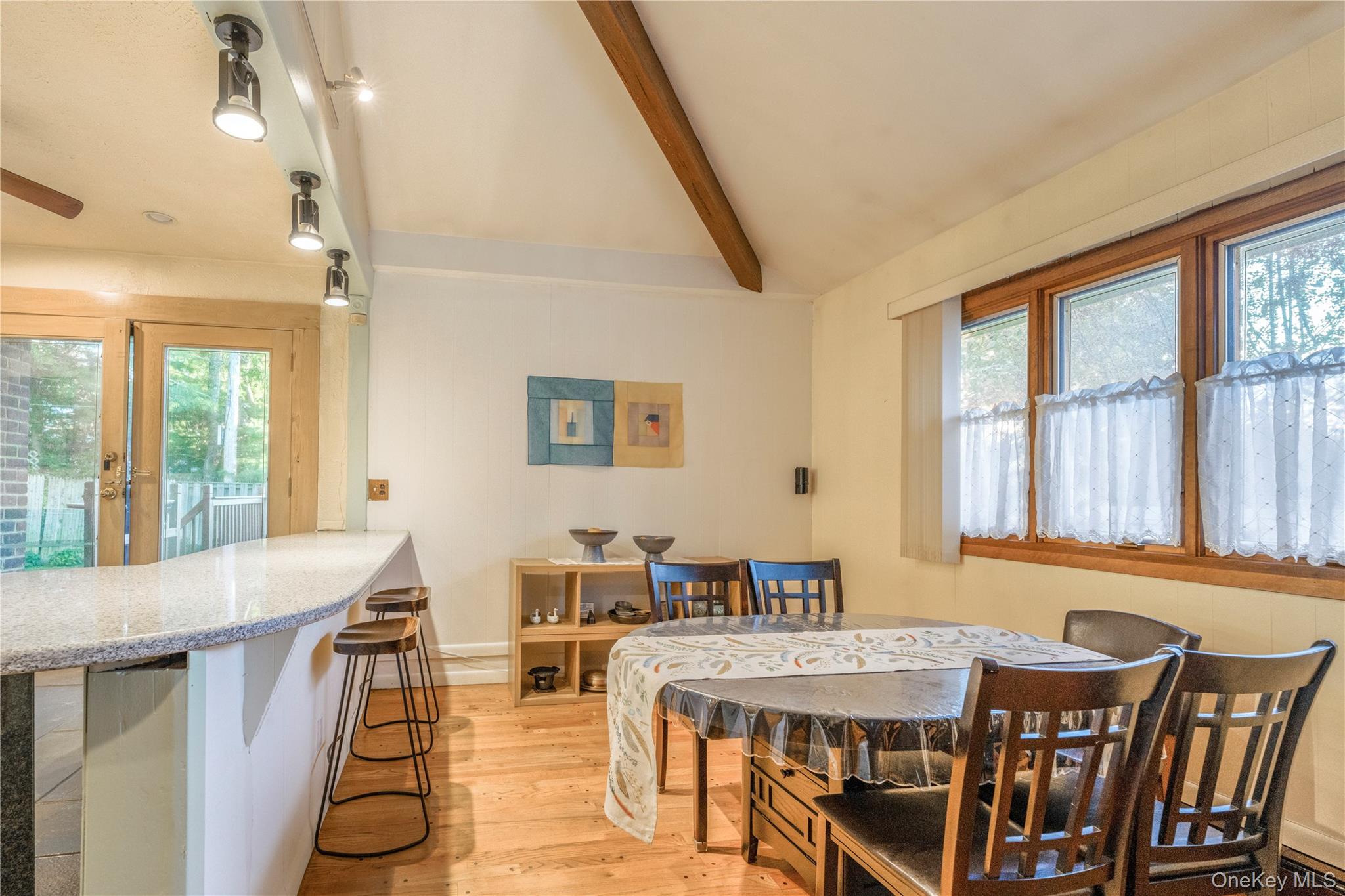 78 Joyce Road Plainview, NY 11803 - Photo 6 of 23 a view of a dining room with furniture window and wooden floor