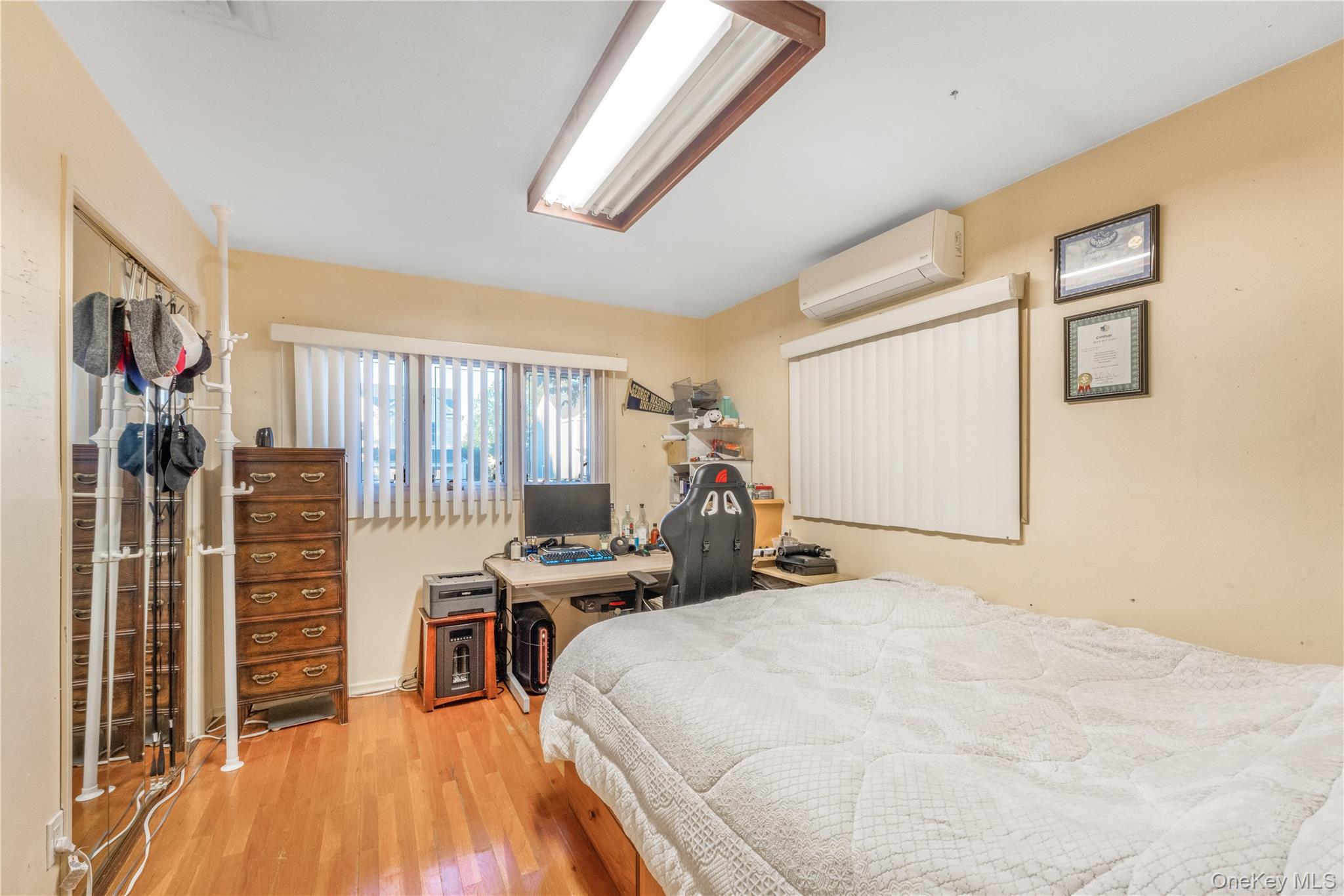 78 Joyce Road Plainview, NY 11803 - Photo 10 of 23 a bed room with a bed and a window