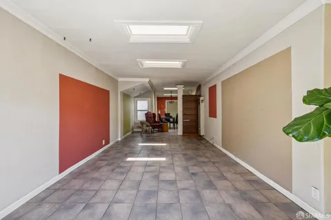 a view of an entryway with wooden floor