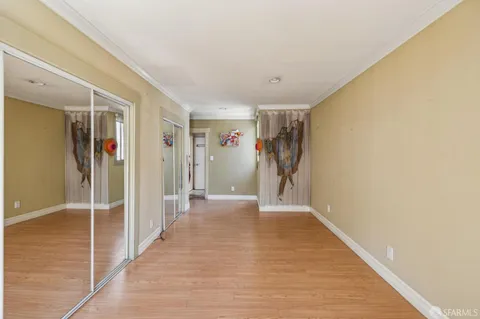 a room that has a bed and a dresser in it