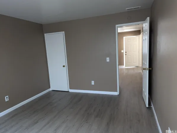 a kitchen with a refrigerator sink and cabinets